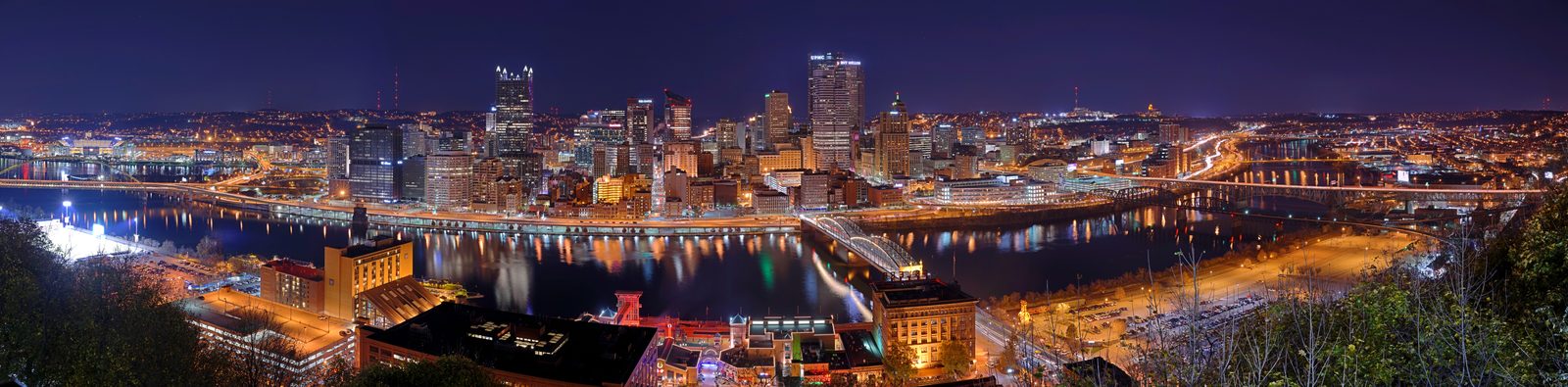 The Pittsburgh skyline at night, the region's anchor city a short drive south of Cranberry Township.